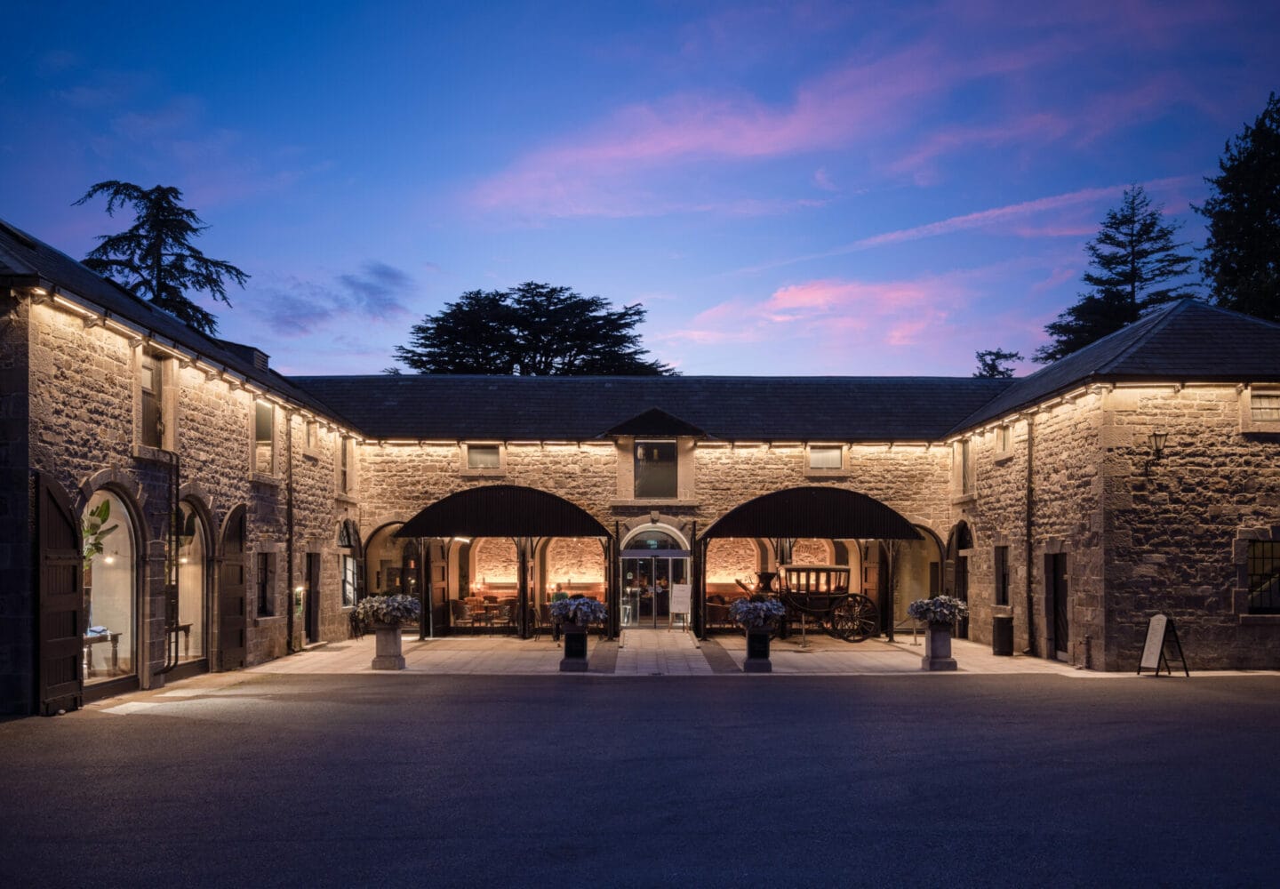 Golf clubhouse at Carton House Estate lit at dusk, Maynooth, Co. Kildare