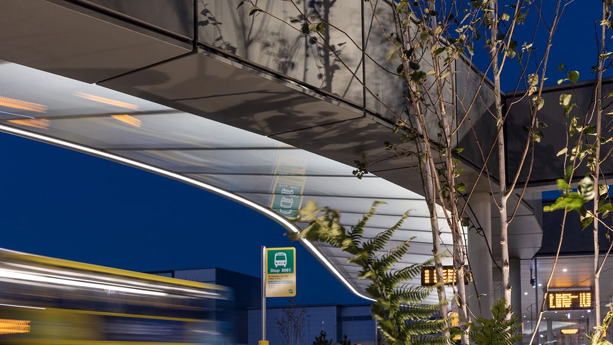 Edge of the lit canopy at Liffey Valley Bus Connect Plaza at dusk