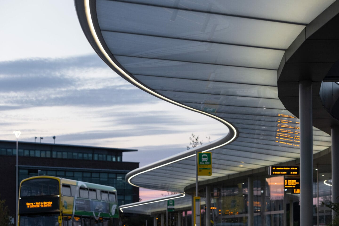 Liffey Valley Bus Connect Plaza canopy and buses at dusk