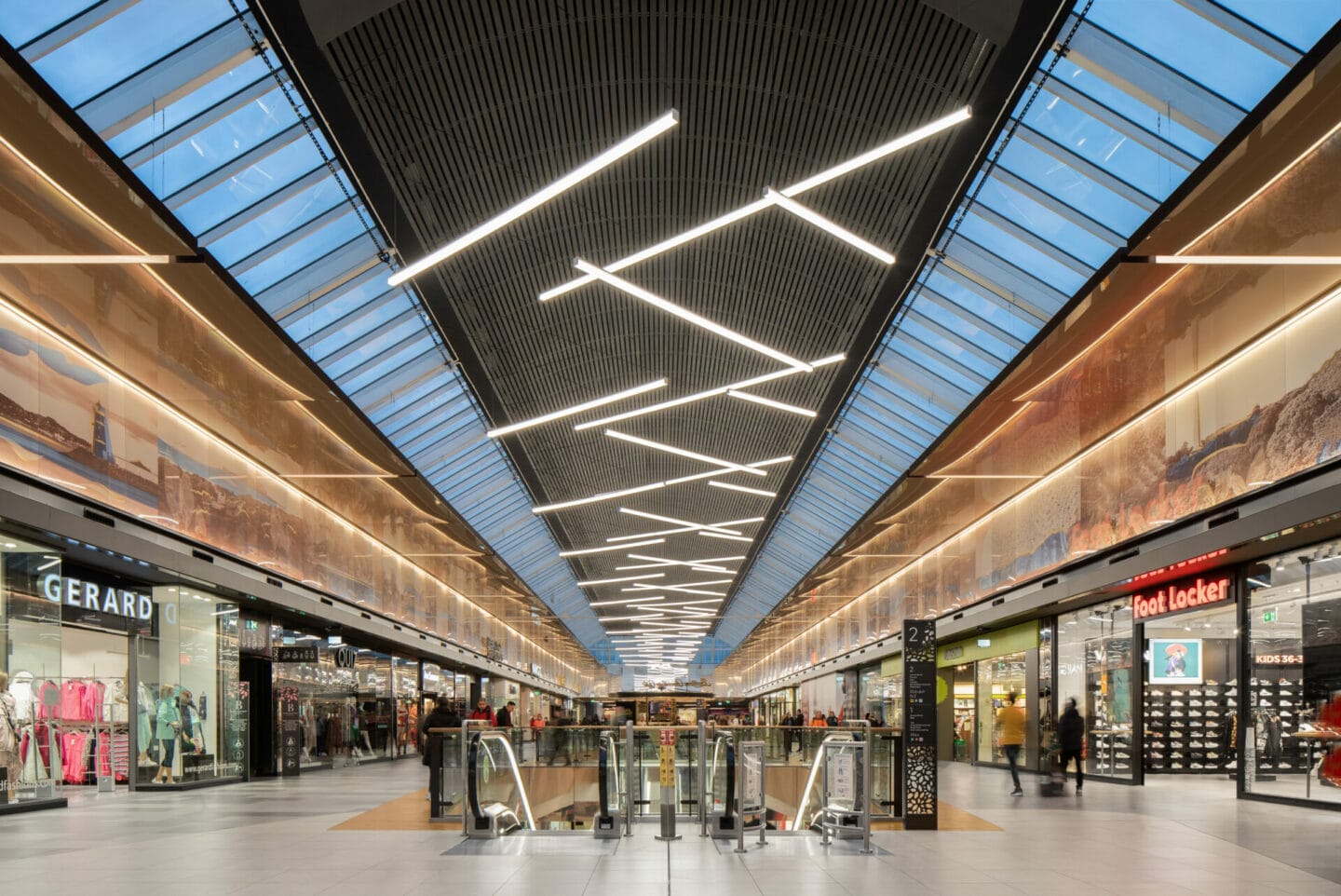 Blanchardstown Shopping Centre mall with linear lighting under the rooflights, Dublin