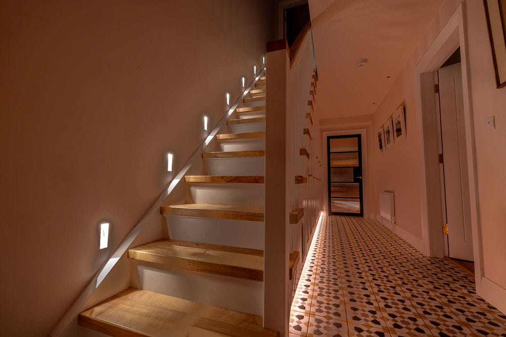 Stairs with low-level step lights in a 1950s terrace house, Kilkenny